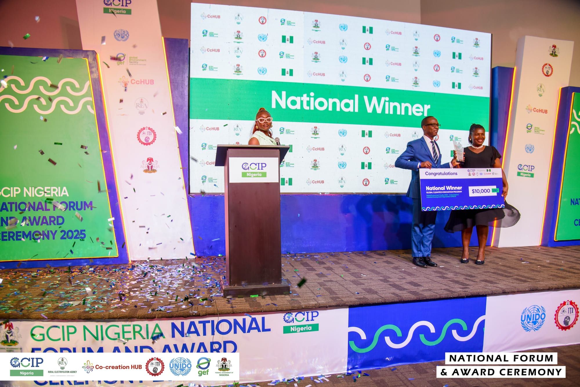 Accepting the $10,000 National Winner award on stage at GCIP Nigeria 2025